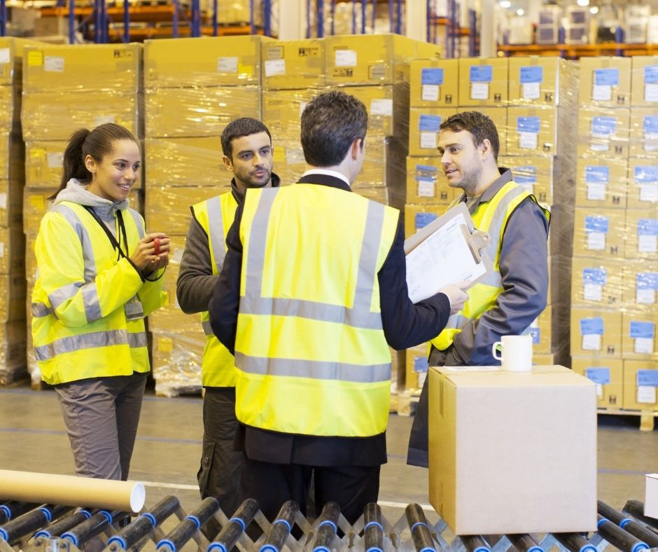 Amazon employees in a warehouse planning